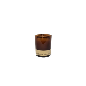 Beeswax candle in amber or red glass